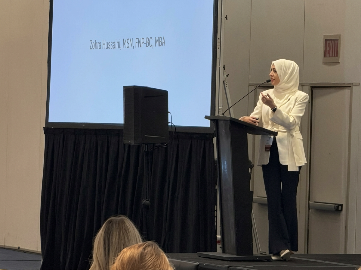Zohra Hussaini presenting on a conference stage