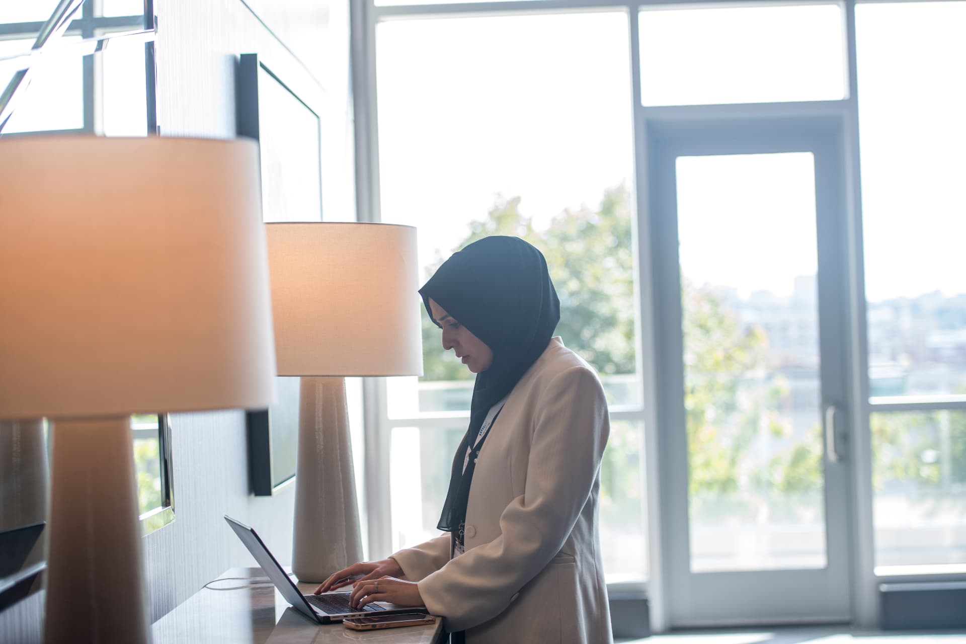 Zohra Hussaini working at her laptop